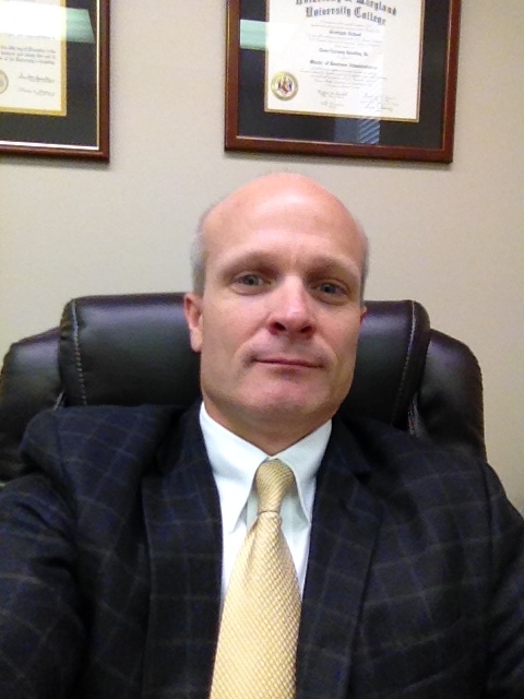 Picture of Lari Gooding, CEO of Allendale County Hospital sitting in his desk chair.