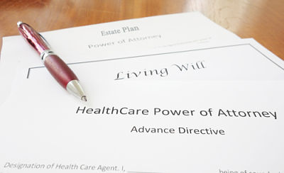 Picture of living will and power of attorney paperwork.