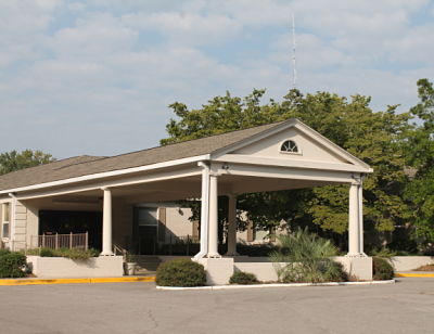 Picture of the front of the hospital building on a sunny day.